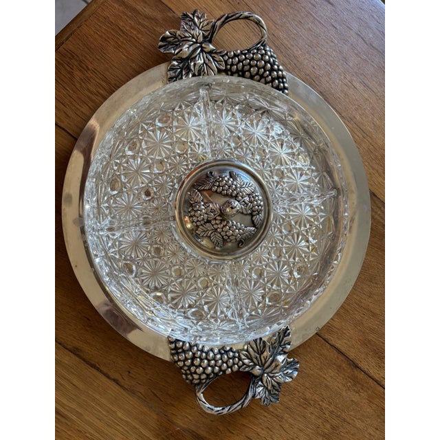 A superb Belle Époque serving platter, combining cut crystal and silver-plated metal in a refined dialogue typical of Art...