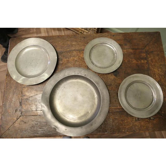 4 Pewter Chargers 4 Antique English pewter plates, they are in acceptable antique condition The largest Charger is...