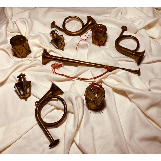 Collection of brass decorations musical instruments and lanterns, French horns trumpet & drums
