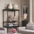 Contemporary display cabinet in black wood veneer and clear glass, designed to showcase works of art, sculptures, books,...