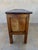 Spanish rustic storage chest in solid chestnut, dating from circa 1880–1920. The front features two carved decorative...