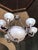 Late 20th Century Neo-Classical Cast Bronze Chandelier With Frosted Crystal Hand-Cut Globes For Sale - Image 4 of 13