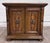 This is a handsome vintage Mediterranean/Spanish Revival style nightstand or end cabinet featuring a warm walnut-tone...