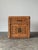 Fully wrapped in woven wicker, this vintage nightstand pairs a single drawer over a two-door cabinet, finished with hand-...