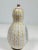 The Bjørn Wiinblad Ceramic Figure Vase with Lid is a rare and sought-after piece from 1951. This Scandinavian-made vase...