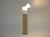 Rare plastic and metal floor lamp designed by Gae Aulenti. Stamped on the underside. The adjustable shade allows you to...