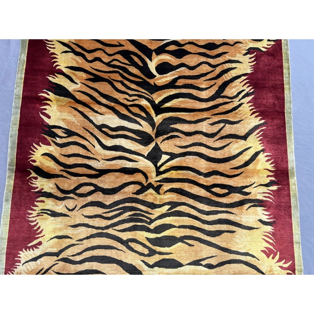 This striking 3' x 5' (36 x 60 inches / 91 x 152 cm) tribal pictorial rug is hand-knotted with luxurious silk, showcasing...