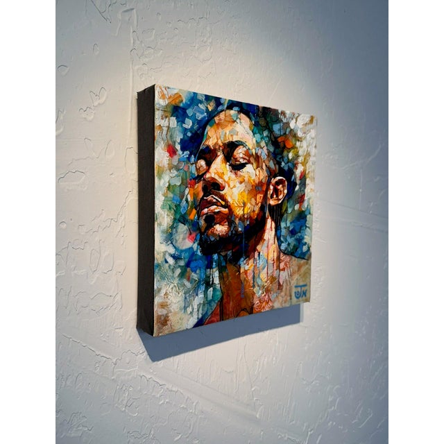 This mixed media piece features a close-up portrait of a contemplative figure, their eyes closed in serene introspection....