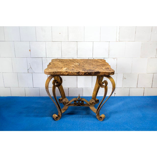 Coffee table with gilded iron frame and marble top. Manufacturer: Colli 1950s This piece is attributed to the mentioned...