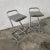 Stools with chromed steel structure and padded fabric seat, 1990s. Measurements: seat height 70cm, width 38cm, depth 44cm....