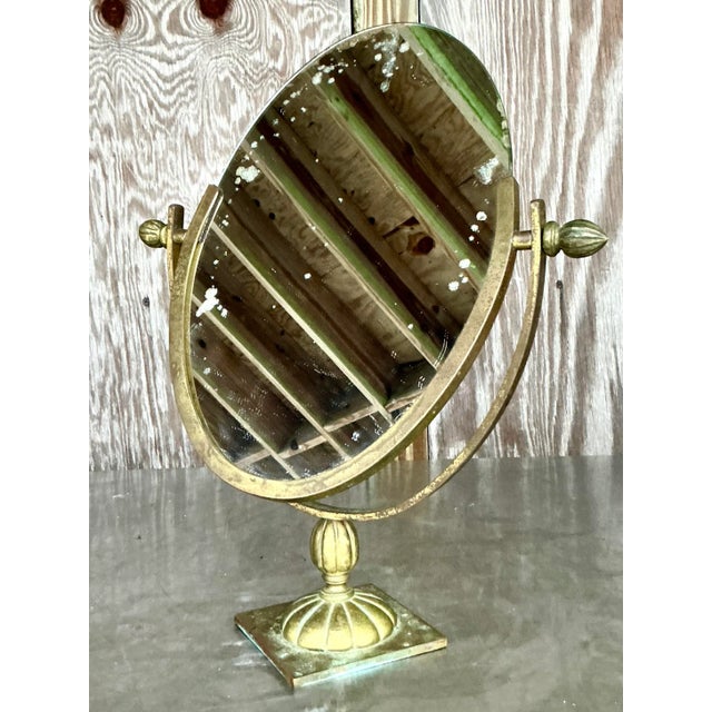 Enhance your décor with the Vintage Regency Patinated Vanity Mirror. Exuding American elegance, this exquisite piece...
