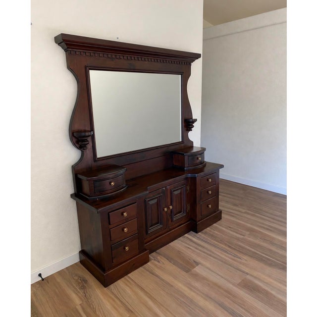 Vintage Heywood-Wakefield dresser with an impressive architectural mirror and warm dark wood finish. The substantial two-...