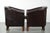 Set of two dark cowhide leather club armchairs in good condition, featuring a timeless and stylish English-style design. :...