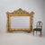 Very large horizontally oriented Florentine wall mirror in the Baroque style. The richly gilt wooden frame is adorned with...