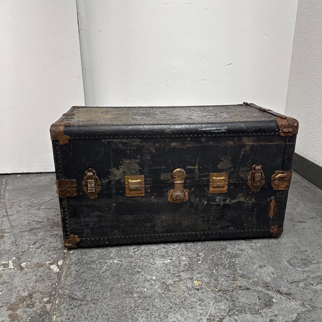 Design Plus Gallery presents a Vintage Steamer Trunk from Hartmann. The rectangular case is wrapped in black material and...
