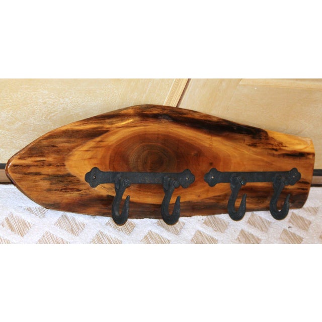A nicely done piece that would go anywhere you needed to hang coats - inside, outside, mudroom, etc! The raw edge wood...