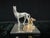 Two-tone metal figurine of a standing mare in silver-tone finish and a resting foal in gold-tone finish, mounted together...