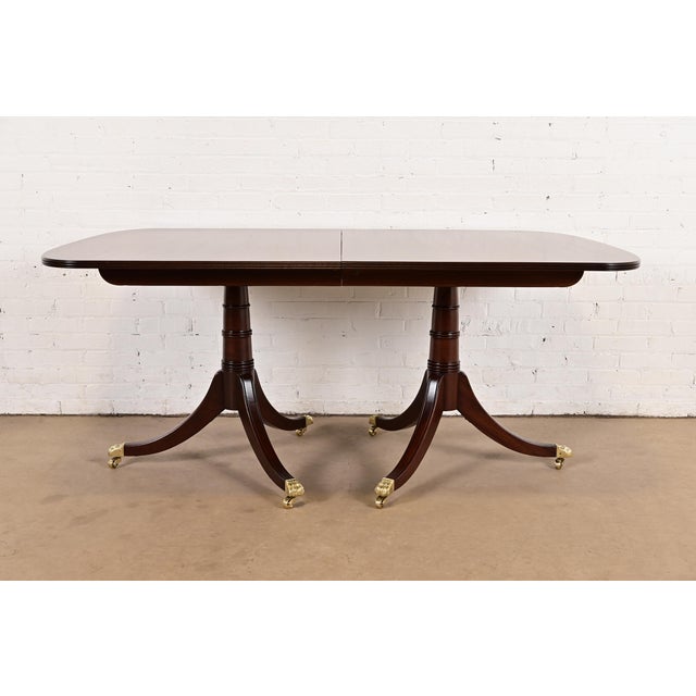 An exceptional Georgian or Regency style double pedestal dining table By Stickley USA, Late 20th Century Beautiful carved...