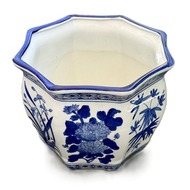 Traditional and classic blue and white porcelain planter. Chinoiserie-style blue and white porcelain jardinière or...