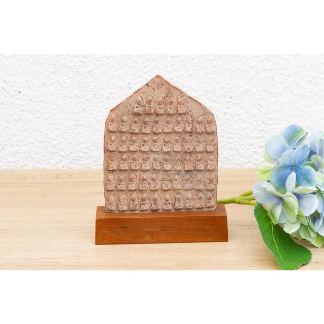 Invite a touch of spiritual history and artistry into your home with this intriguing Buddhist votive tablet, presented on...