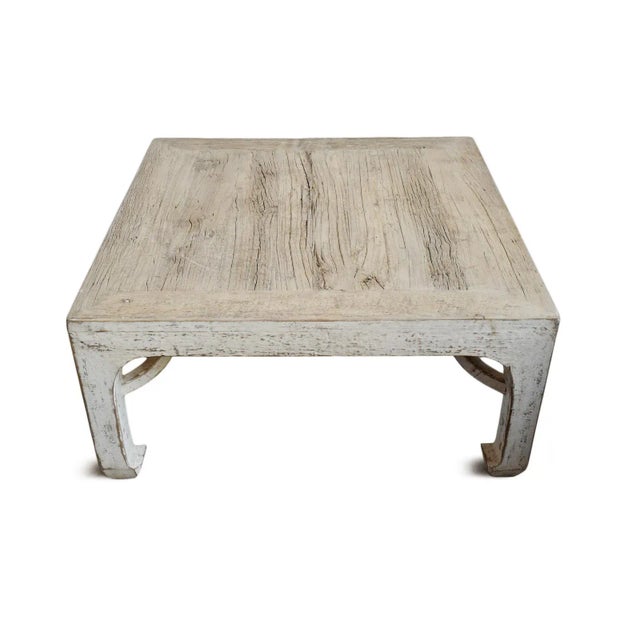 Vintage worn white solid wood Ming square coffee table. Beautiful wood grain and distress. Recommended for under cover use...