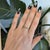 Ten round Zambian emeralds glow in a rich forest green across this solid 14K yellow gold band, with no center stone to...