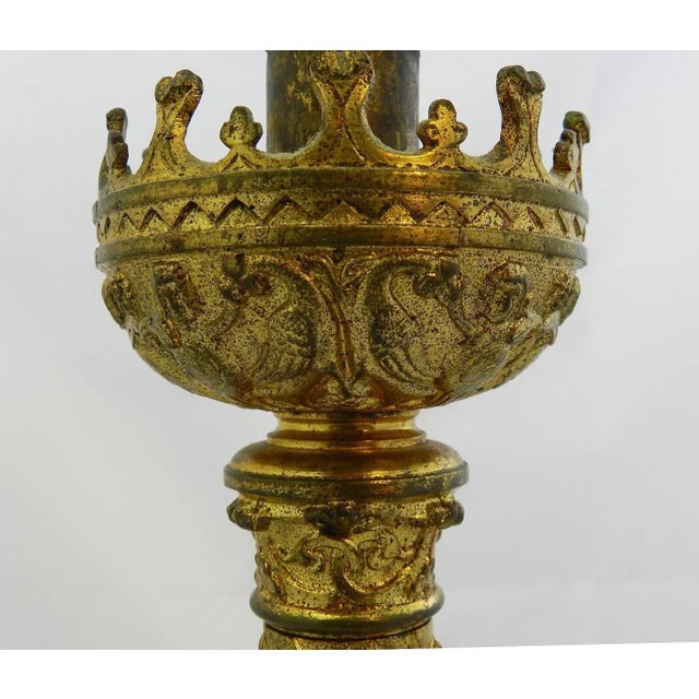 Antique church candlestick later converted to electricity. Belle epoque ormolu gilded metal with good original patina due...