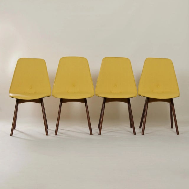 Set of four teak dining chairs with yellow vintage Viper vinyl made at Furniture Factory G.J. van Os N.V. in Culemborg...