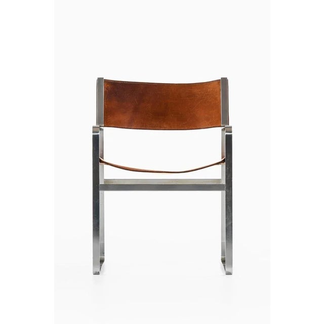 Armchair in steel and original leather by hans wegner, 1970s additional information: material: steel and original leather...