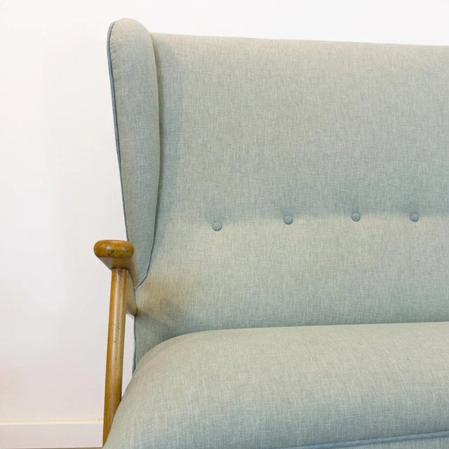 Two -seat Mid Century Sofa Manufactured in Spain in the 50s Hague wood restored and upholstered with cloth in grayish blue...