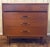 Elevate your space with this timeless mid-century modern gem—a compact 3-drawer lowboy dresser that embodies the era's...