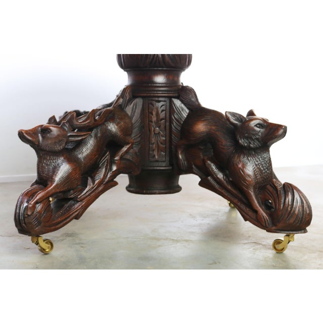 Stunning 19th century French antique hunting table / beast table in black forest style, large oval model. Amazing full...