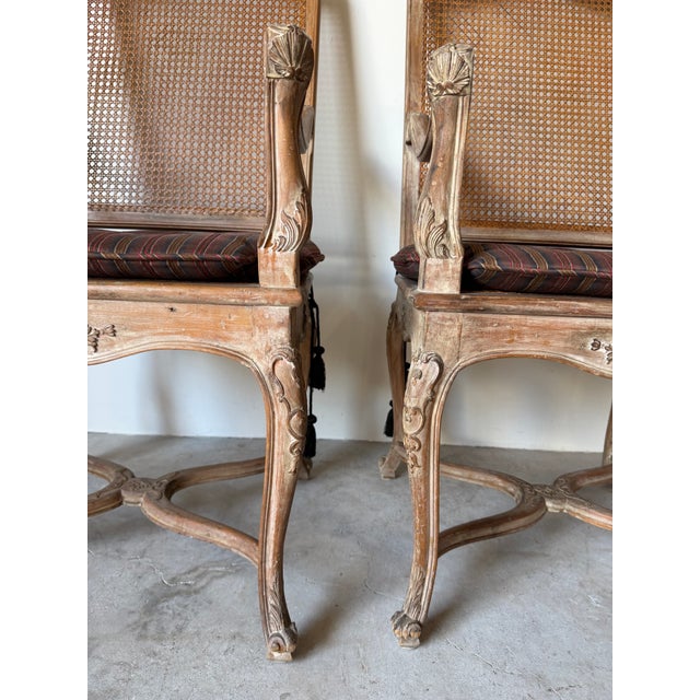 Wood Vintage Hollywood Regency Louis XV-Style Carved Wood & Cane Armchairs – A Pair For Sale - Image 7 of 13