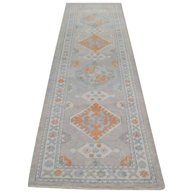 Hand-knotted with care using traditional rug-making techniques, this wool rug blends timeless craftsmanship with a modern...