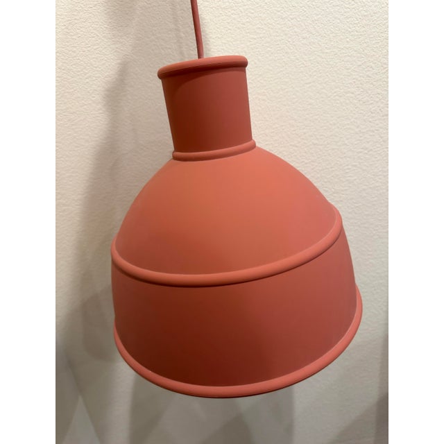 Pair of Terracotta Unfold pendant lamps by Muuto, part of the MillerKnoll Collective. Made of silicone rubber. Canopy...
