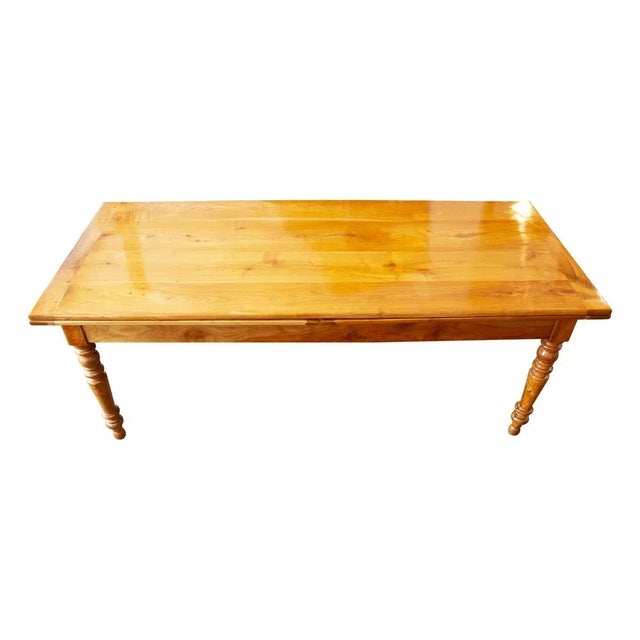 Introducing our exquisite offering: a remarkable country house table crafted from solid cherry wood, originating from the...