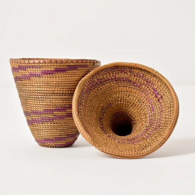 The Tutsi Tight Weave Basket with Lid from Rwanda epitomizes the artistry and tradition of the Tutsi community's weaving...