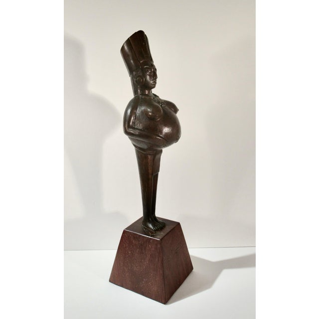 This artwork titled "Ixchel" 1977, is a bronze sculpture with brown patina by noted Mexican artist Enrique Gottdiener...
