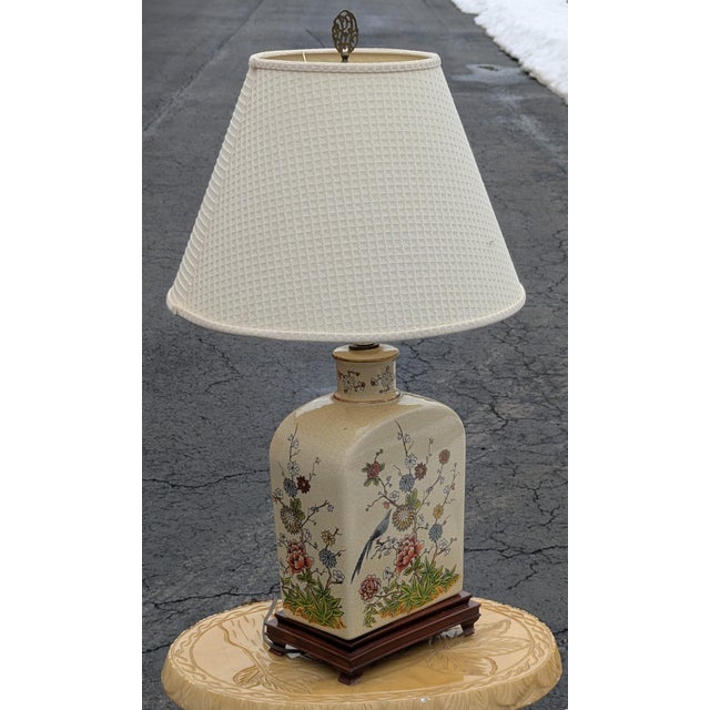 33-Inch Antique-Style Crackle Glaze Table Lamp featuring Traditional Asian Bird and Flower Art. This striking piece serves...