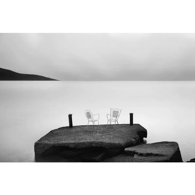 Two empty chairs by the sea. Thassos, Greece. Unframed Empty Chairs by Alex Axon Print, 16" x 24"