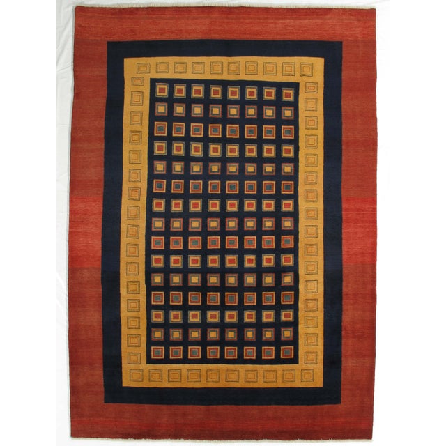 Vintage hand-knotted Persian Fine Lori Gabbeh rug featuring a bold geometric composition with a central grid of square...