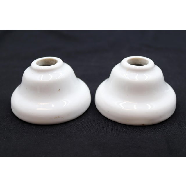 Vintage bell shaped faucet covers made of ceramic with a white porcelain finish. Stamped Republic Cleveland. Good...