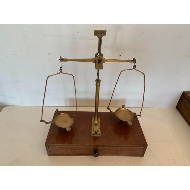 Antique jeweler's balance scale wooden case brass balance mechanism and pans weighing weights inside the drawer made by...