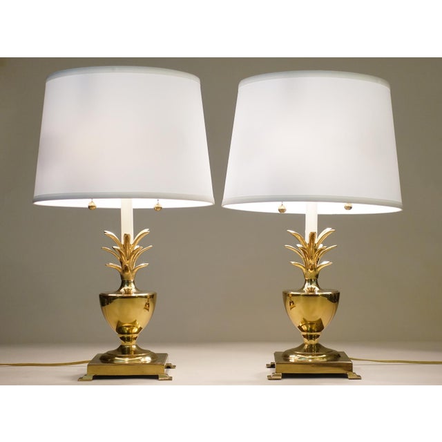 A bold and impressive matched pair of vintage Hollywood Regency Modern highly polished Brass Pineapple-like Urn form table...