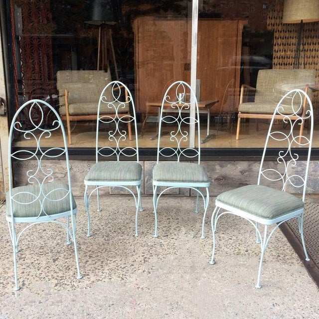 Set of four, mid century, patio, garden, outdoor chairs feature scrolled, wrought iron, high back frames newly painted in...