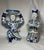 A striking complementary pair of mid-20th-century Chinese hand-painted porcelain court figures, each modeled standing and...