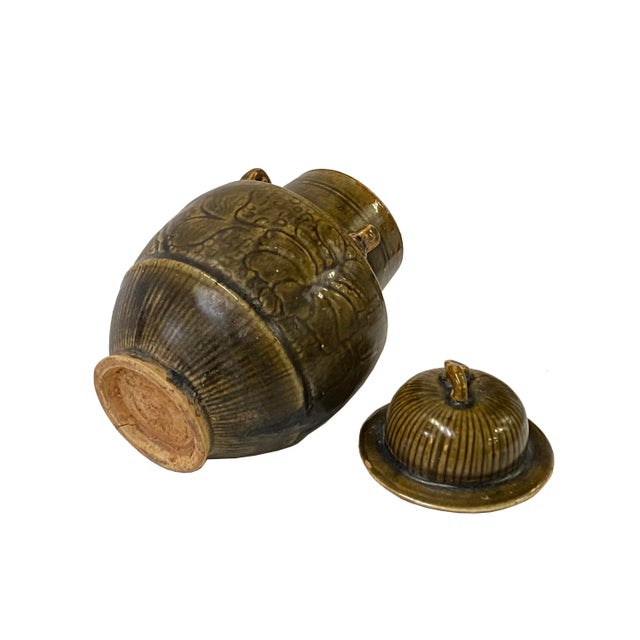 This is a handmade Chinese accent decorative art made of ceramic in brown beige tan mix color with simple lines and floral...