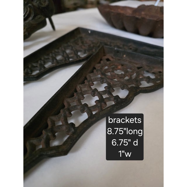 Three vintage cast Iron items. The bracket have nice details and would be great with a wood or glass shelf. The match...
