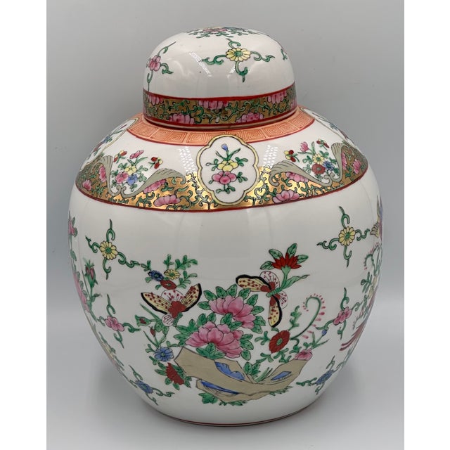 Stunning Chinese Famille Rose Oriental Gilt Porcelain Lidded Ginger Jar. This exquisite piece beautifully captures the...