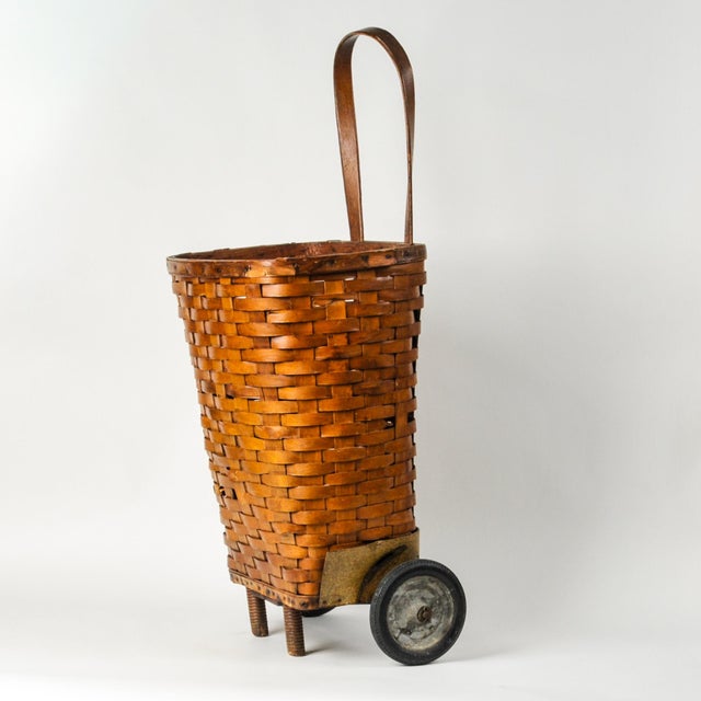 Beautiful vintage woven market cart, appears handmade. Sturdy functioning basket, with some breaks in the weave as shown....
